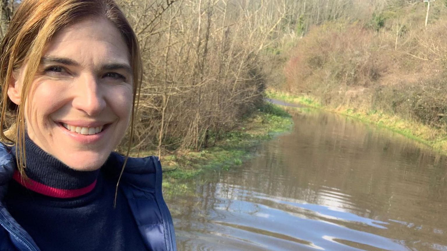 Georgina Stevens standing in a flooded road