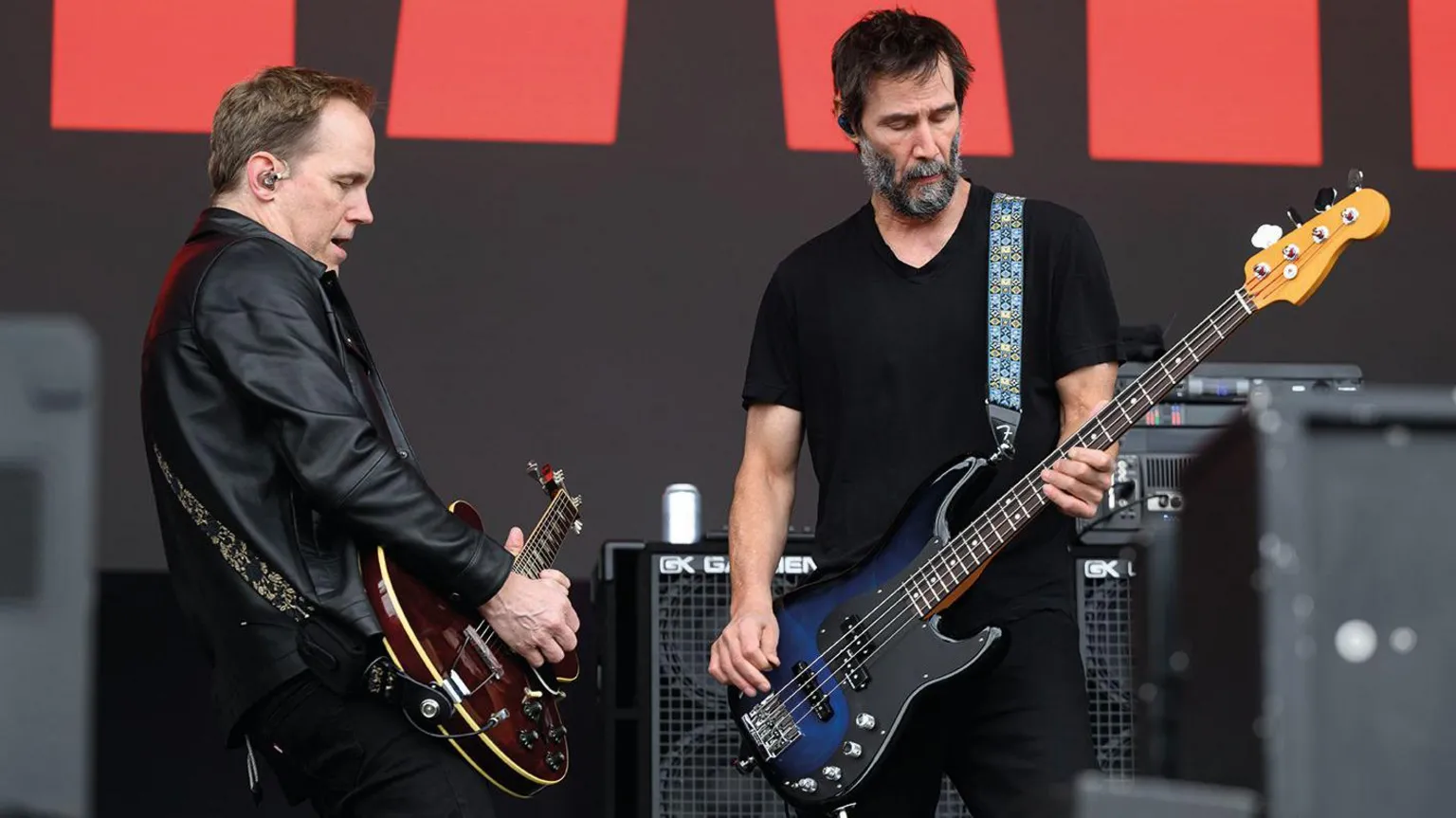 Getty Images A guitarist on the left and a bass player on the right.