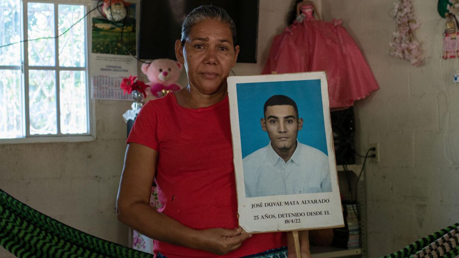 Marcela Alvarado holds up a picture of her son José Duval Mata