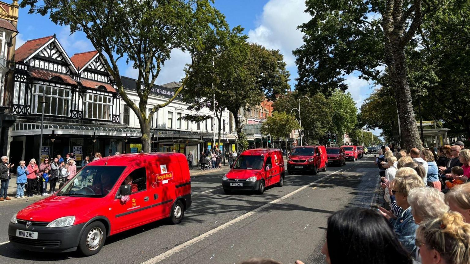 Royal Mail vans drive along Lord Street in Southport in tribute to Elsie