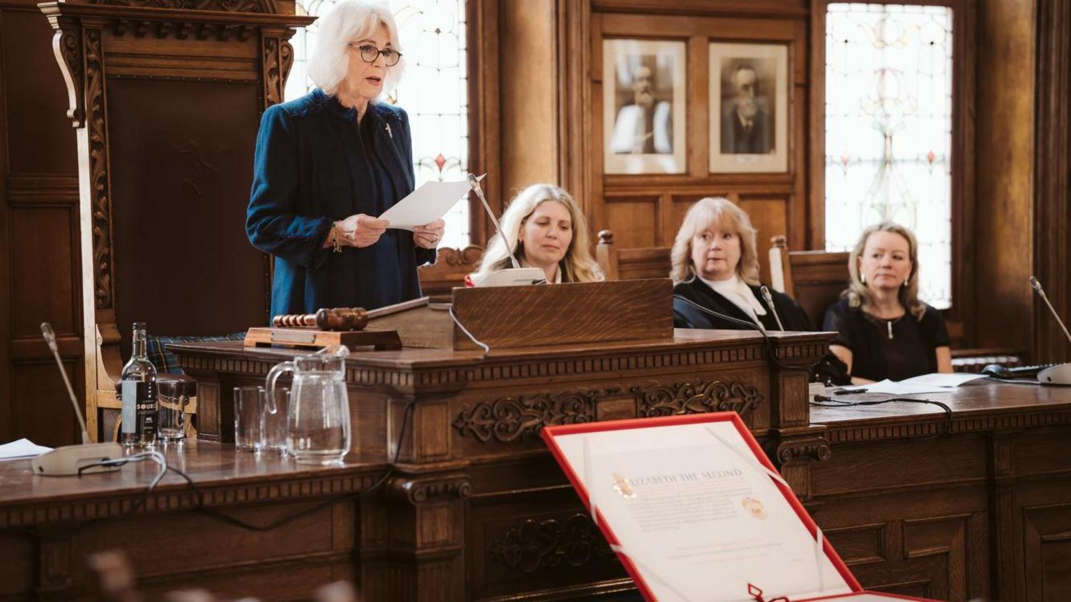 Queen Camilla delivering a speech in the council chamber