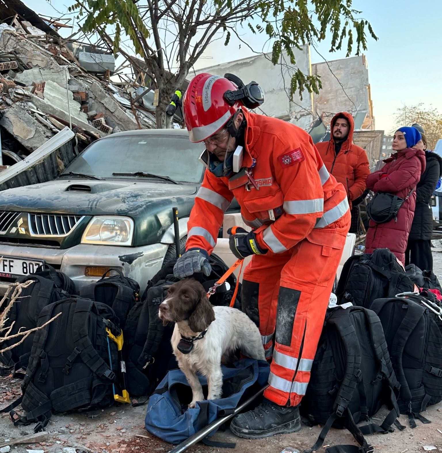 Rescue worker with sniffer dog