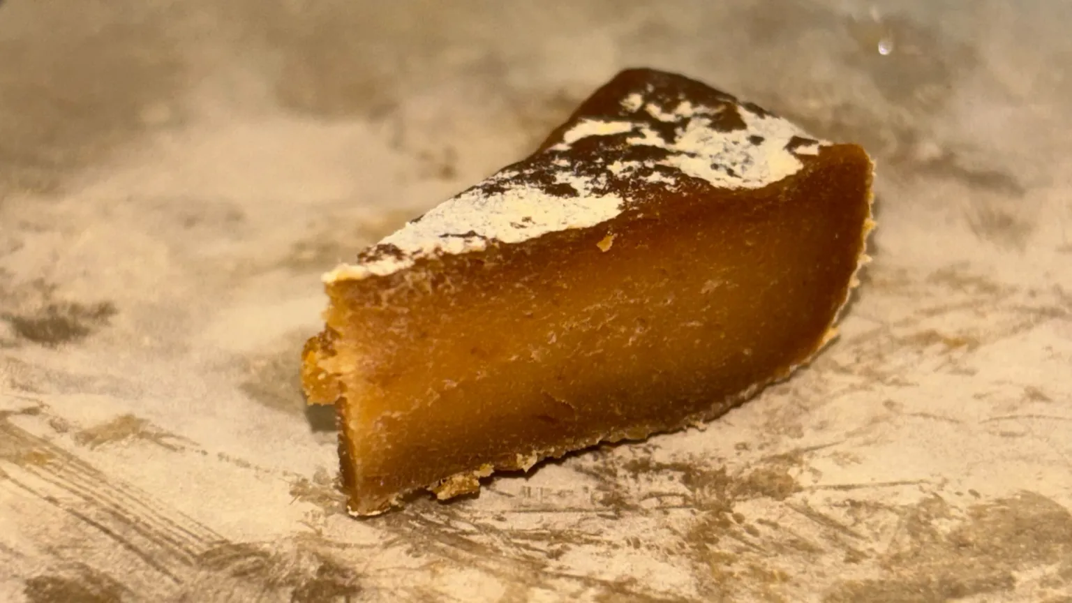 Alessandra Massa, Anna-Katharina Preidl A slice of the lab-made cheese, which is brown rather that a typical cheese colour. It looks quite edible.