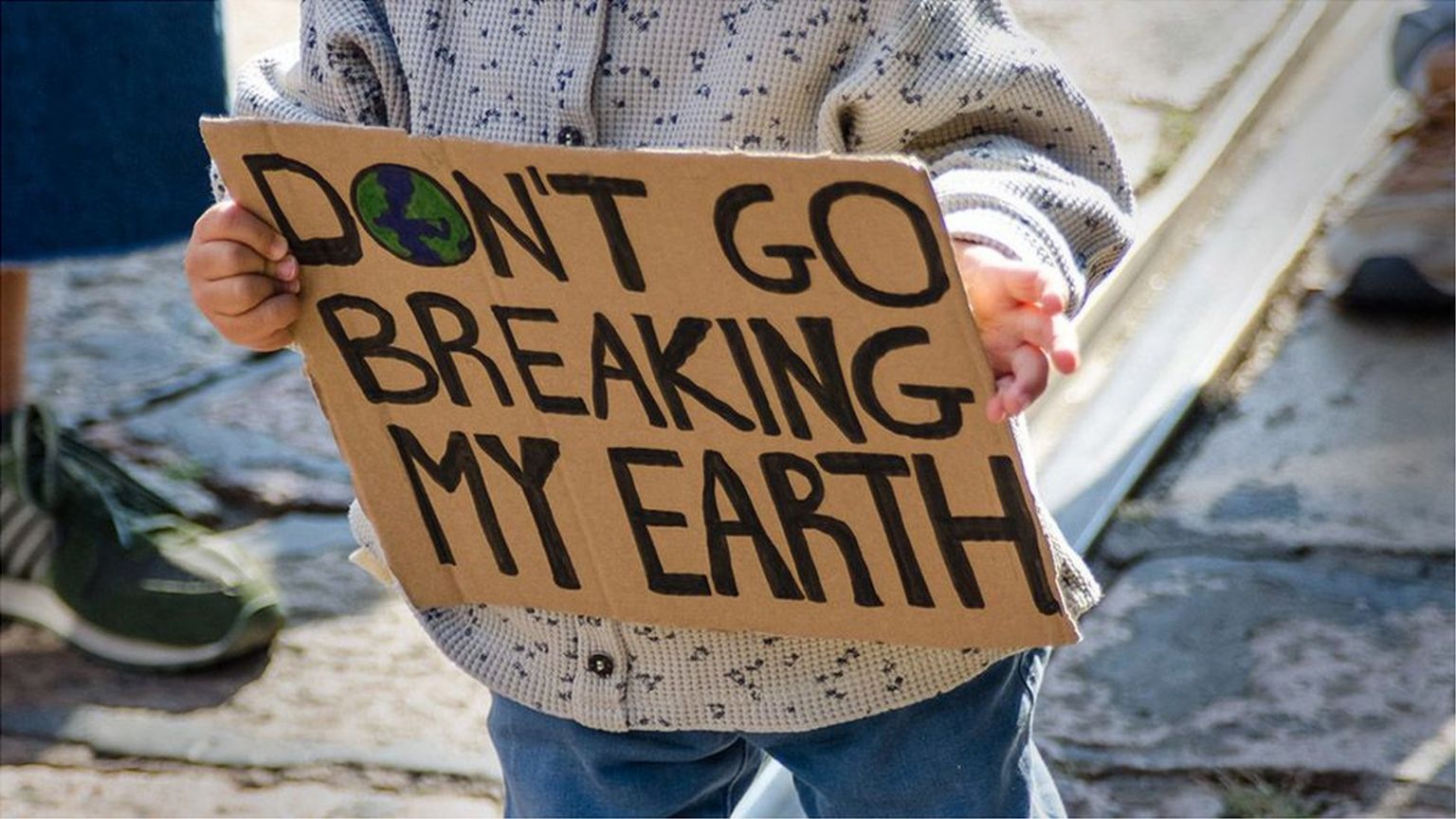 Child holding climate placard