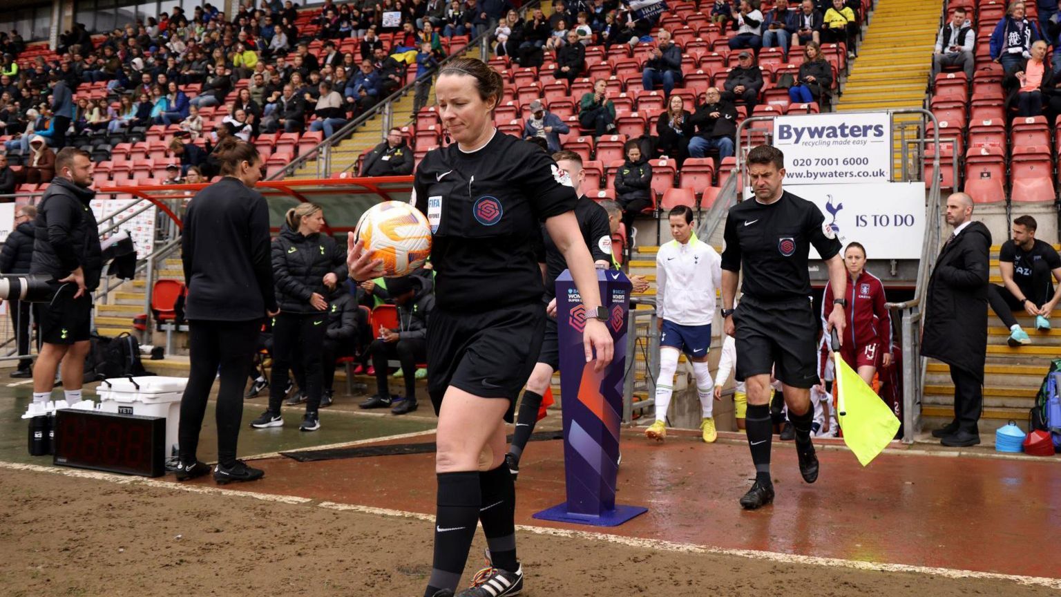 Stacey Pearson refereeing a football game