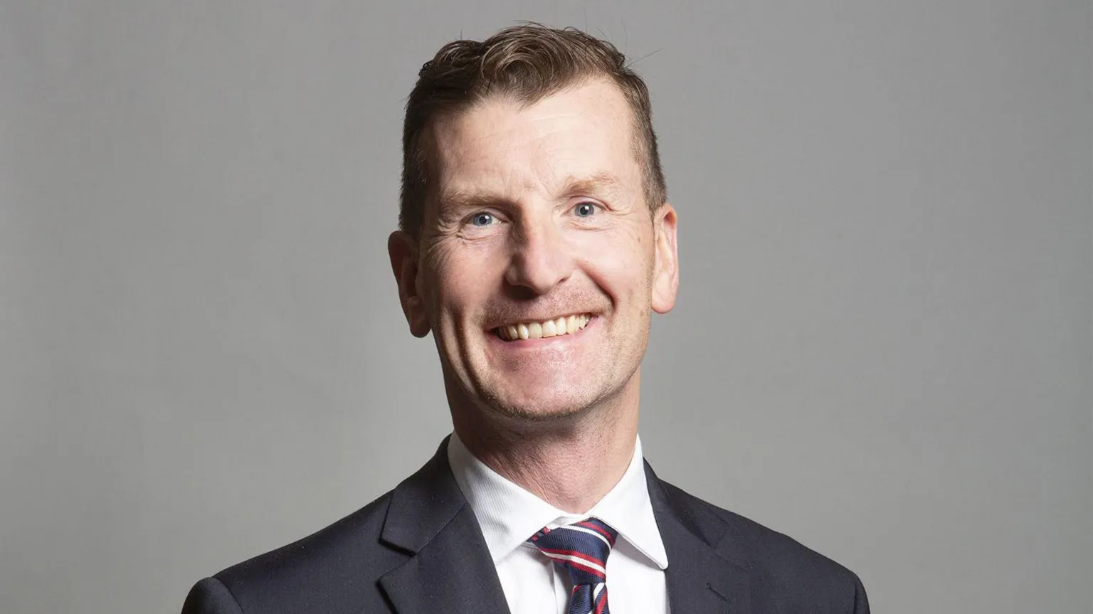 UK Parliament/PA Dave Doogan has short brown hair and wears a dark suit and white shirt