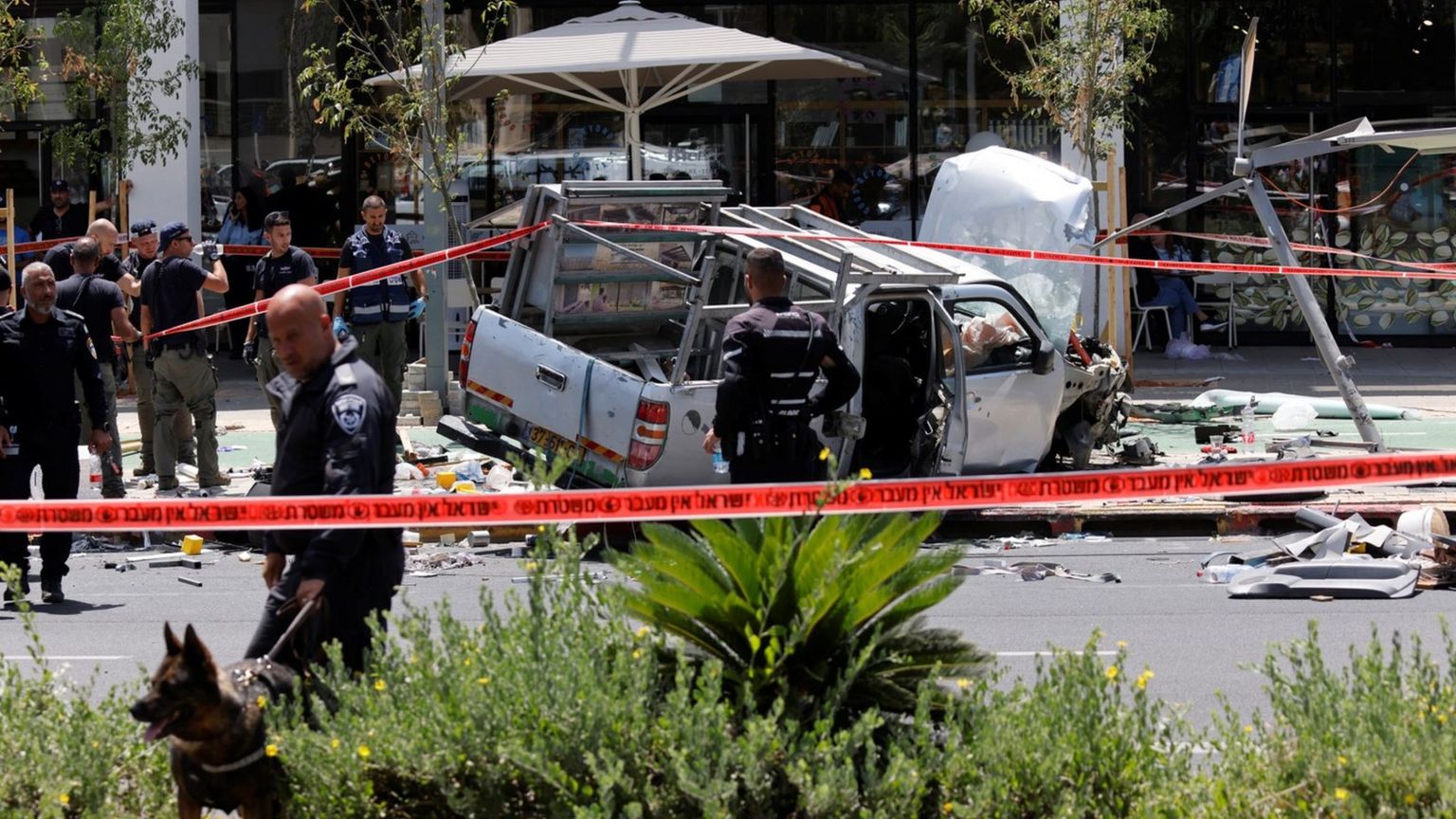 Israeli security personnel and first responders at the scene of a car-ramming attack in Tel Aviv, Israel (4 July 2023)