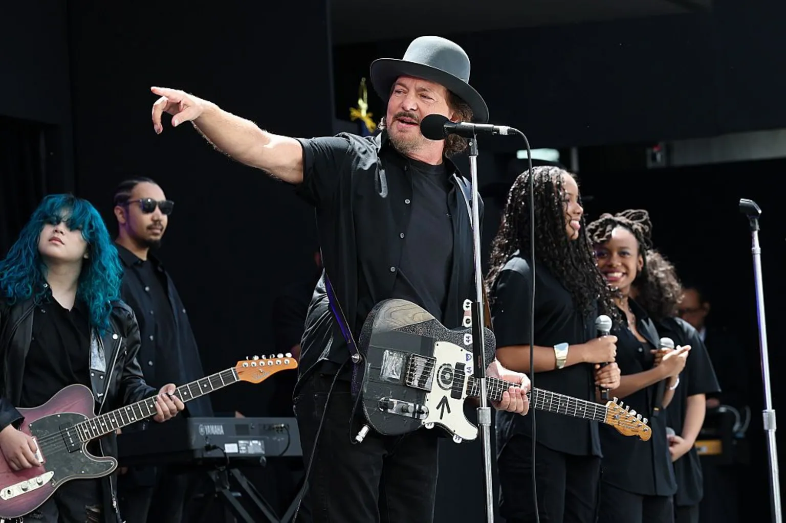 Getty Images Eddie Vedder points onstage while he performs with Guitars Over Guns during the dedication ceremony.