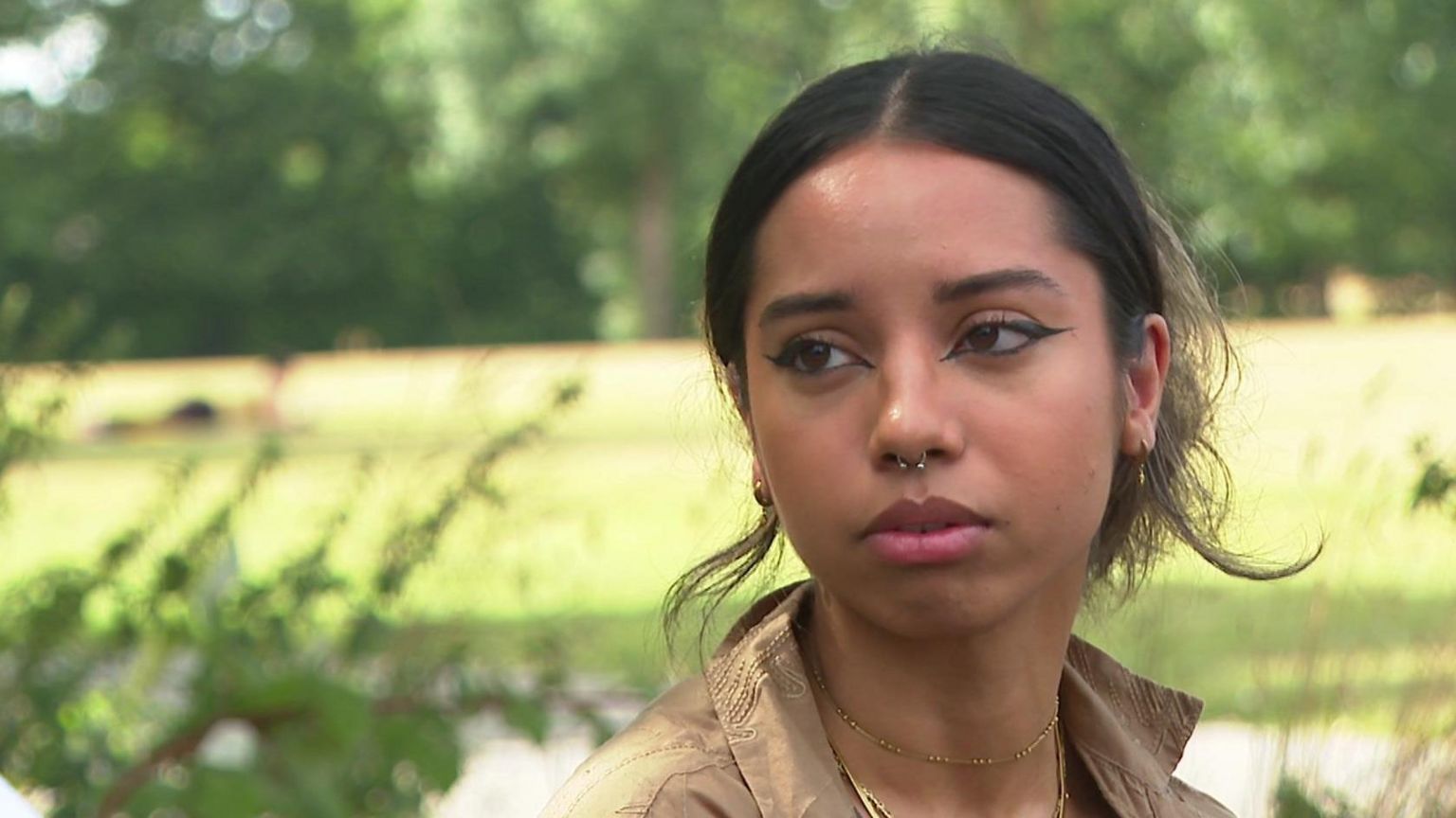 Zahra, a young woman, looking at the camera.