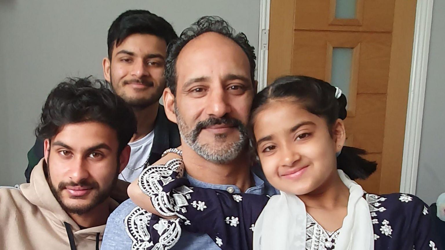 Sfiyah with her father, Gulafhfaq and her brothers Kaden and Haider. 