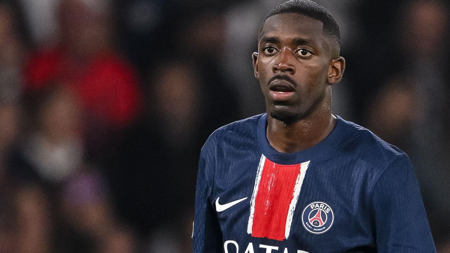 Ousmane Dembele looks on in a PSG game