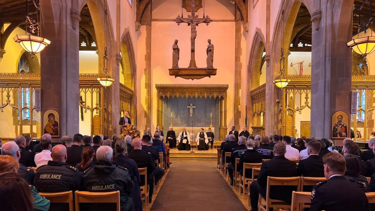 Church interior showing members if the emergency service in the congregation