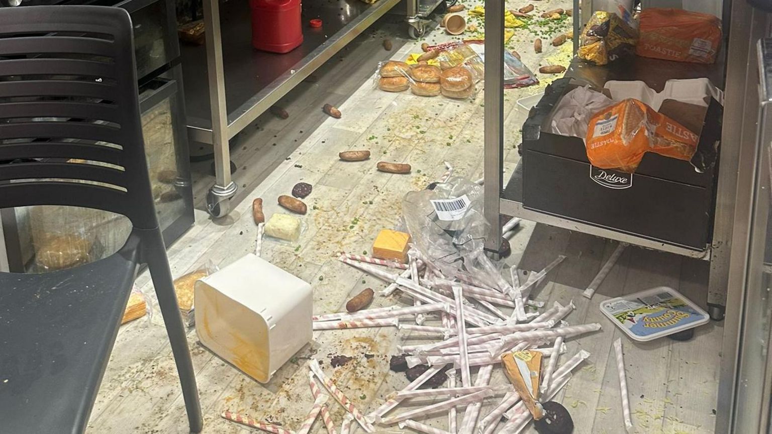Food, drink and mess on the floor of the cafe kitchen