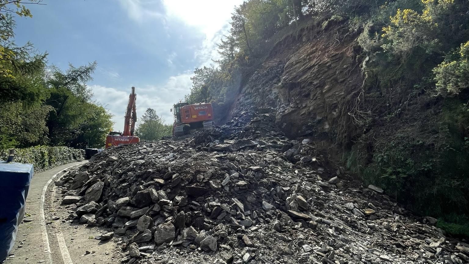 Mountain Road: Work to remove landslide debris under way - BBC News