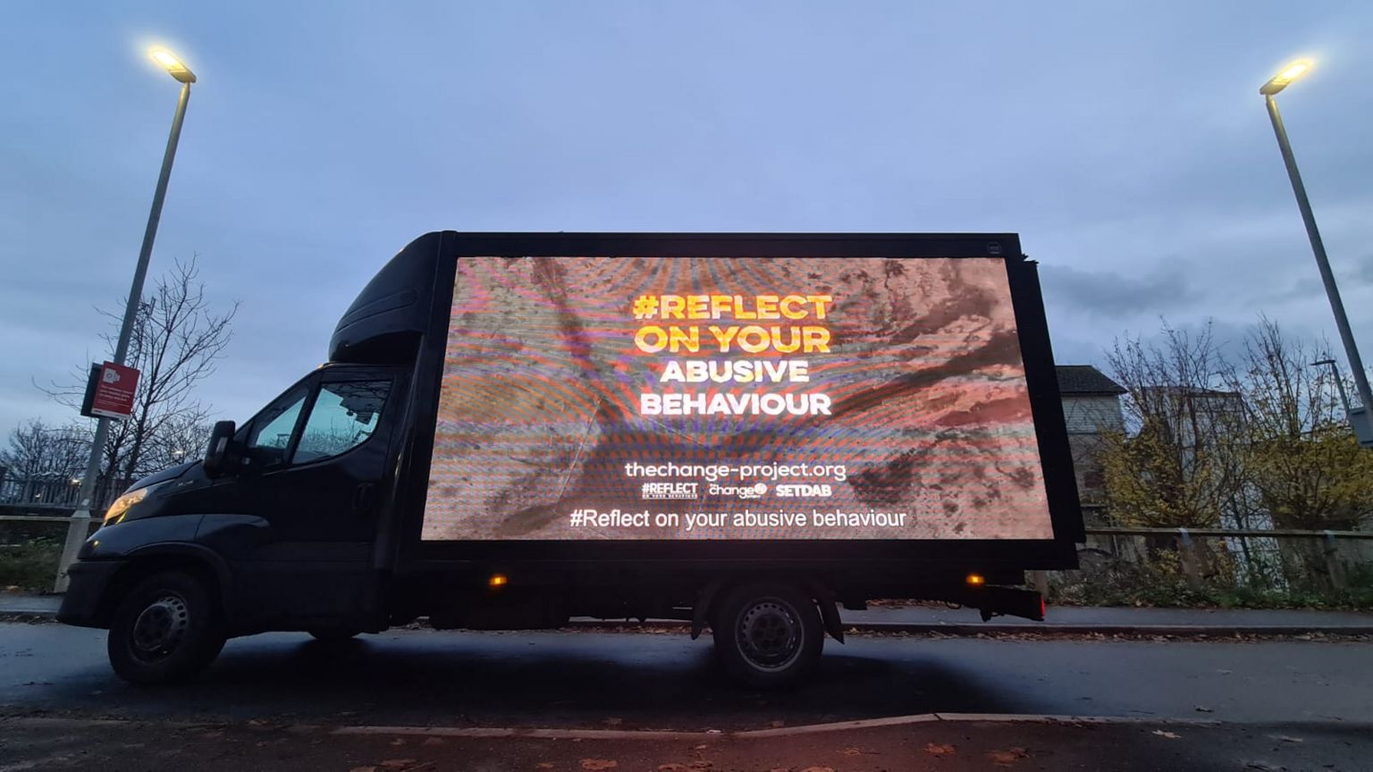 Van with digital billboard side displaying Essex Police's 'Reflect' campaign.