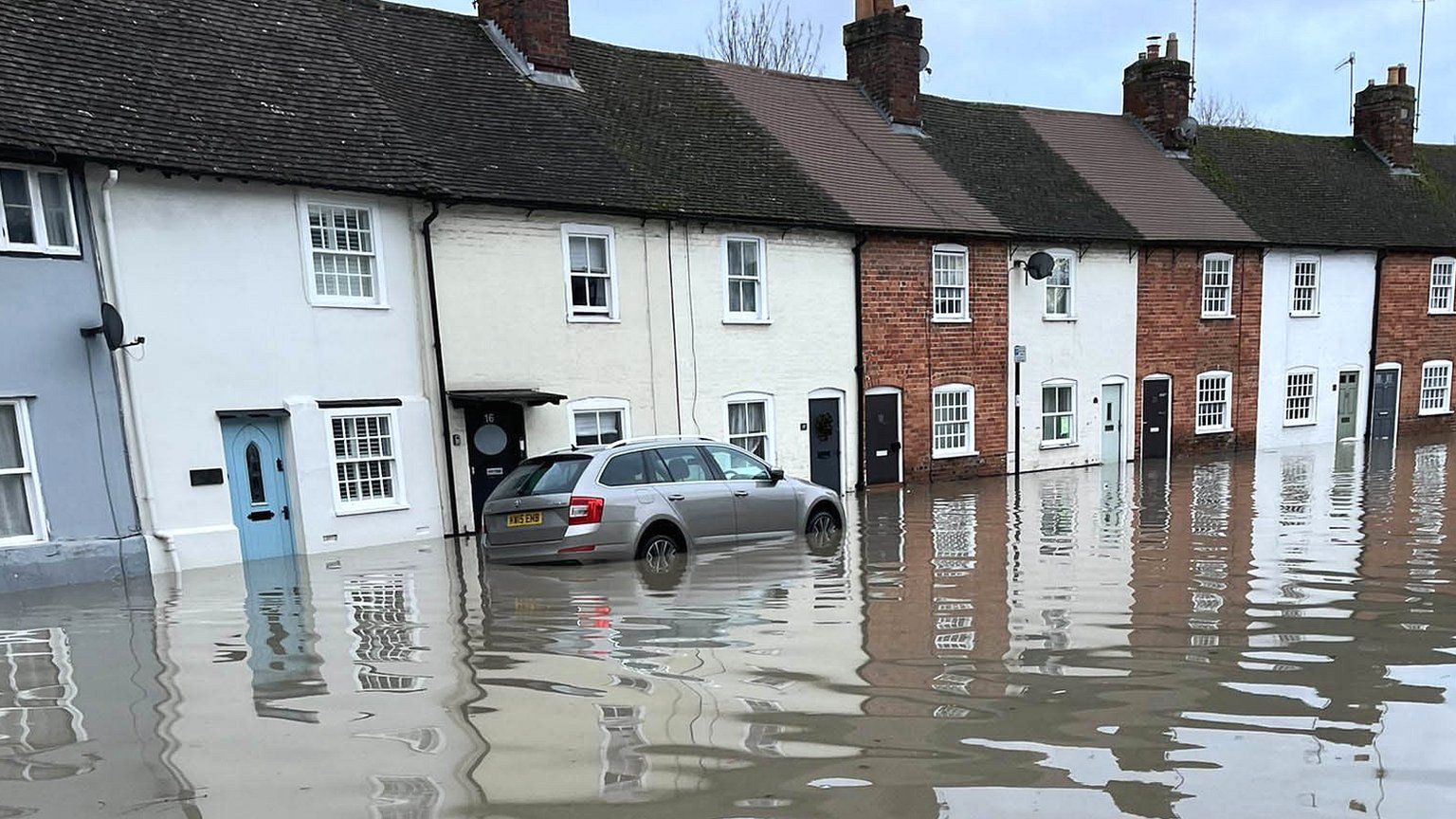 Houses with flood water above their front doors