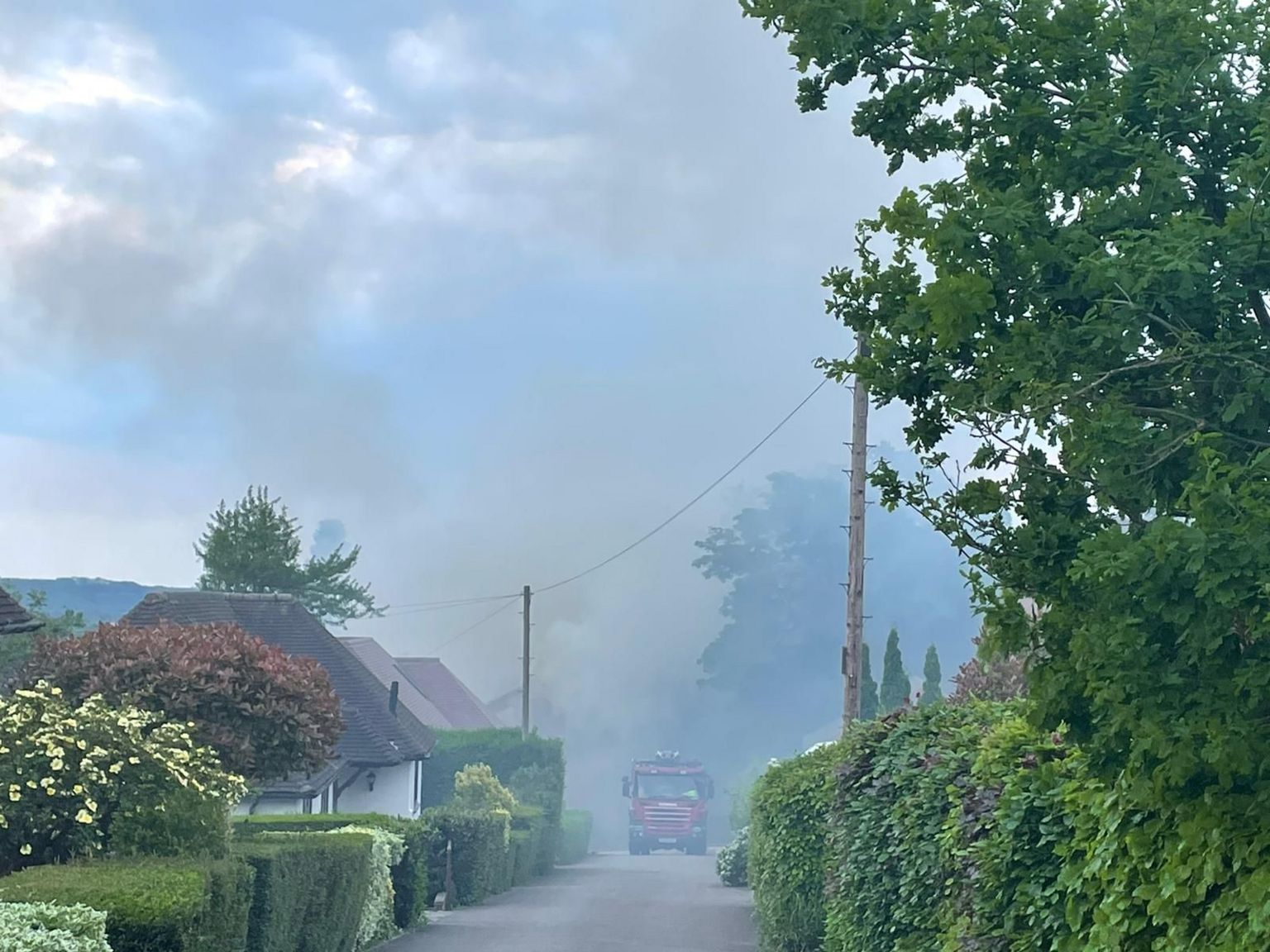 A cloud of smoke over nearby houses