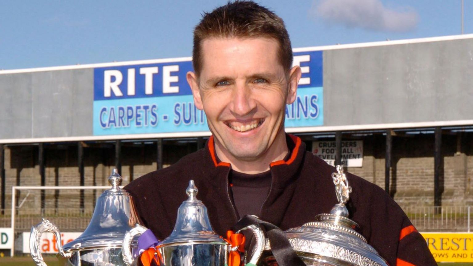 Stephen Baxter with Crusaders' intermediate trophies