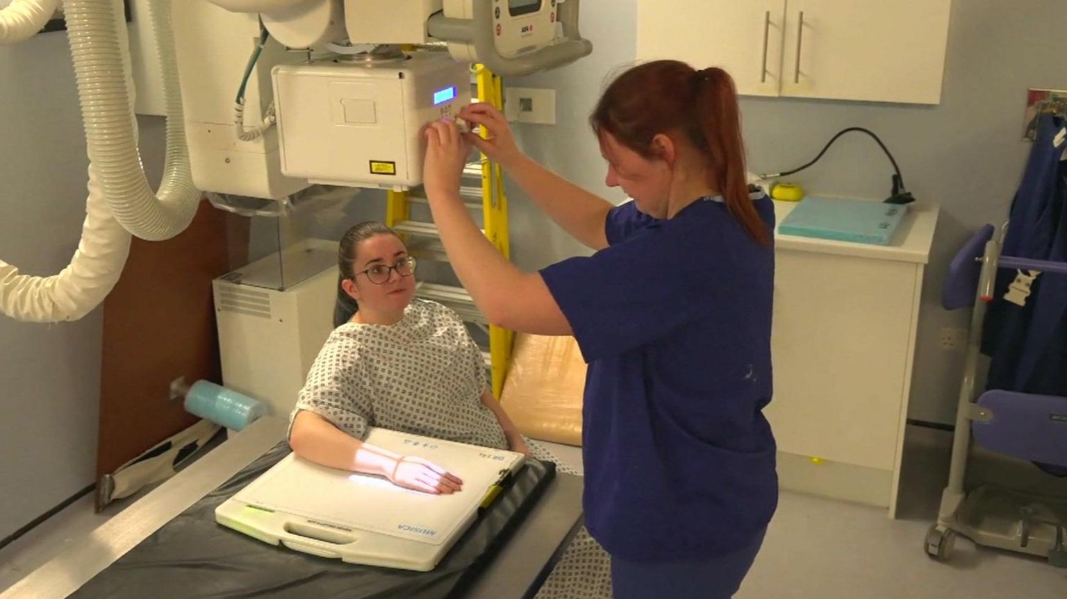 Someone's wrist being scanned by the new technology