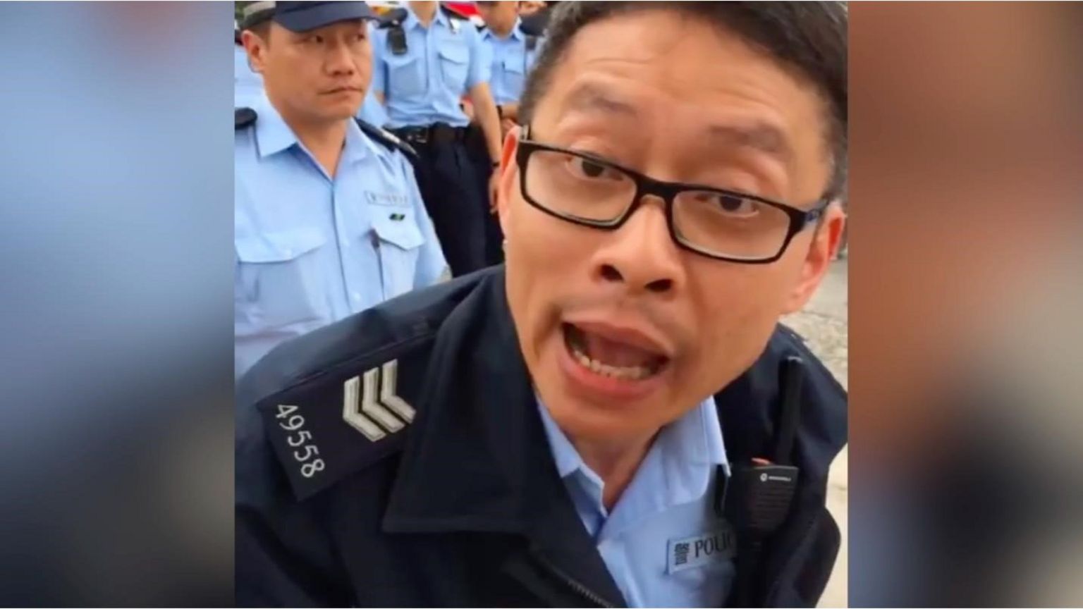 Policeman reading activist his rights before arrest