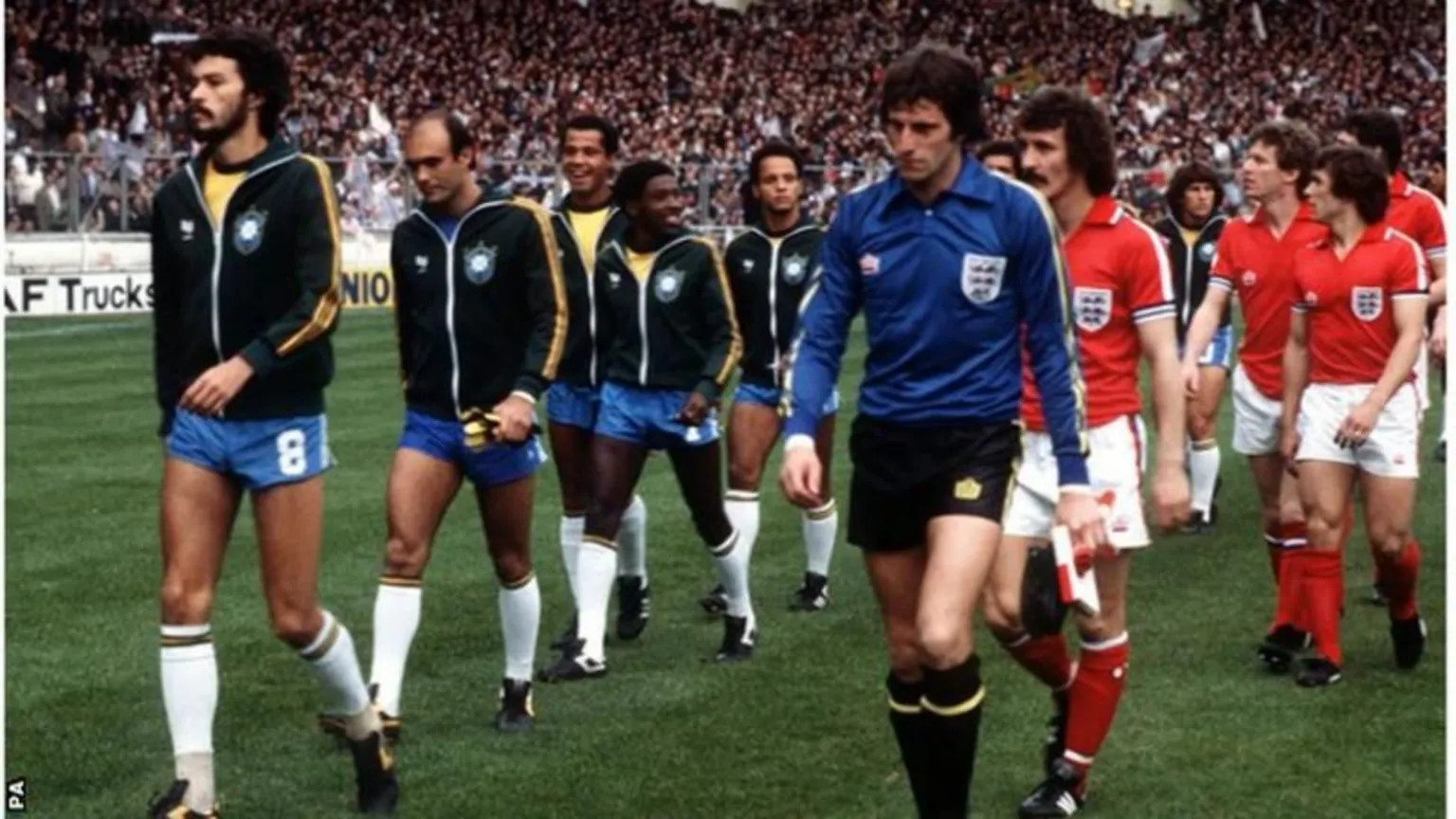 PA Media England and Brazil teams walk on to the pitch at Wembley