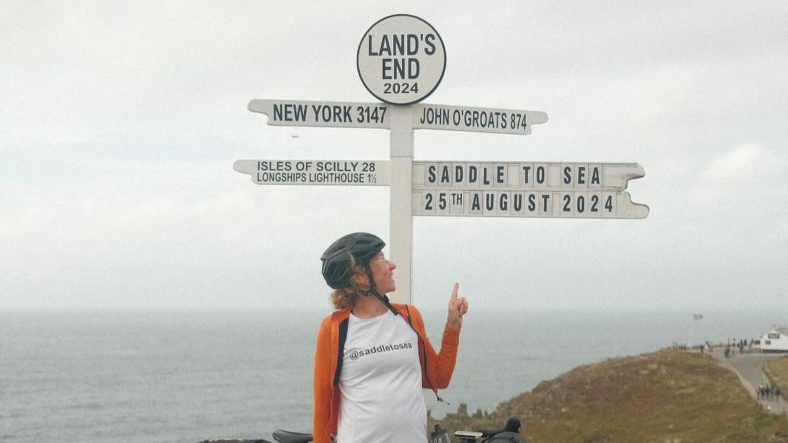 Katy Roberts pictured in Land's End in Cornwall after finishing her cycle