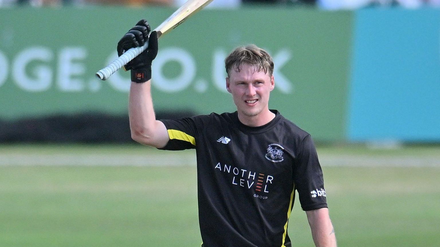 Miles Hammond raises his bat after his second limited-overs ton for Gloucestershire