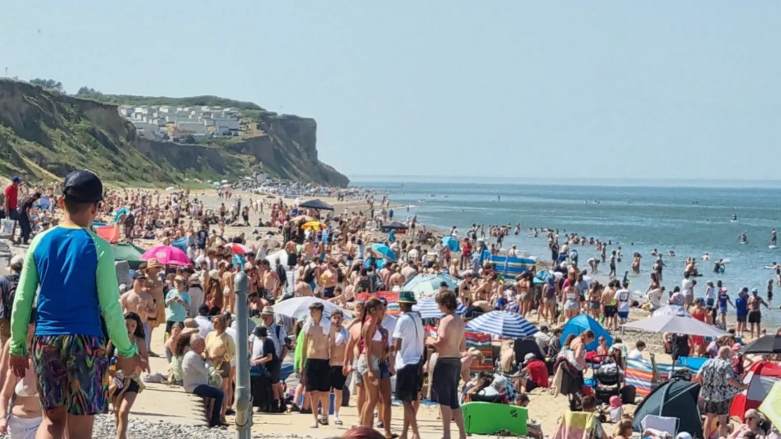 Contributed Hordes of people on the beach and in the sea at Cromer.