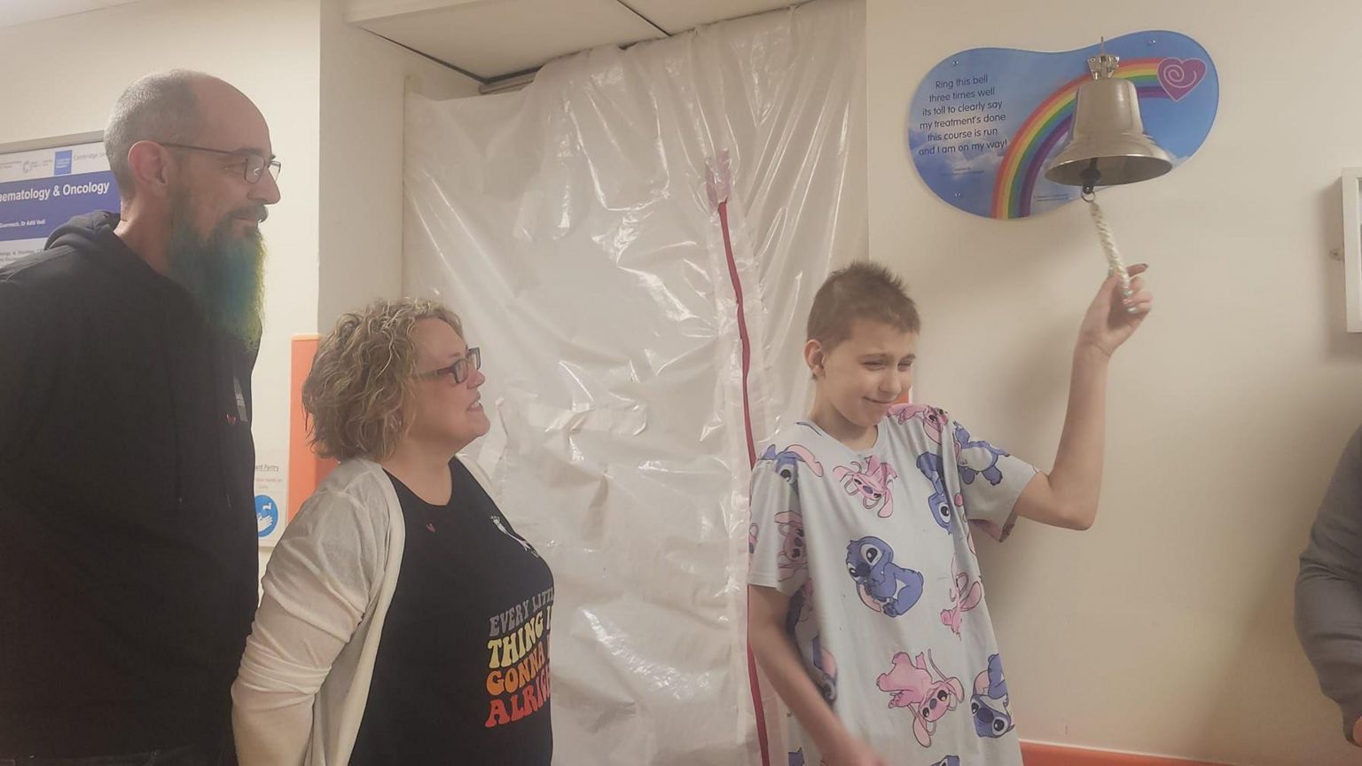 Bethany ringing the cancer free bell at Addenbrooke's Hospital