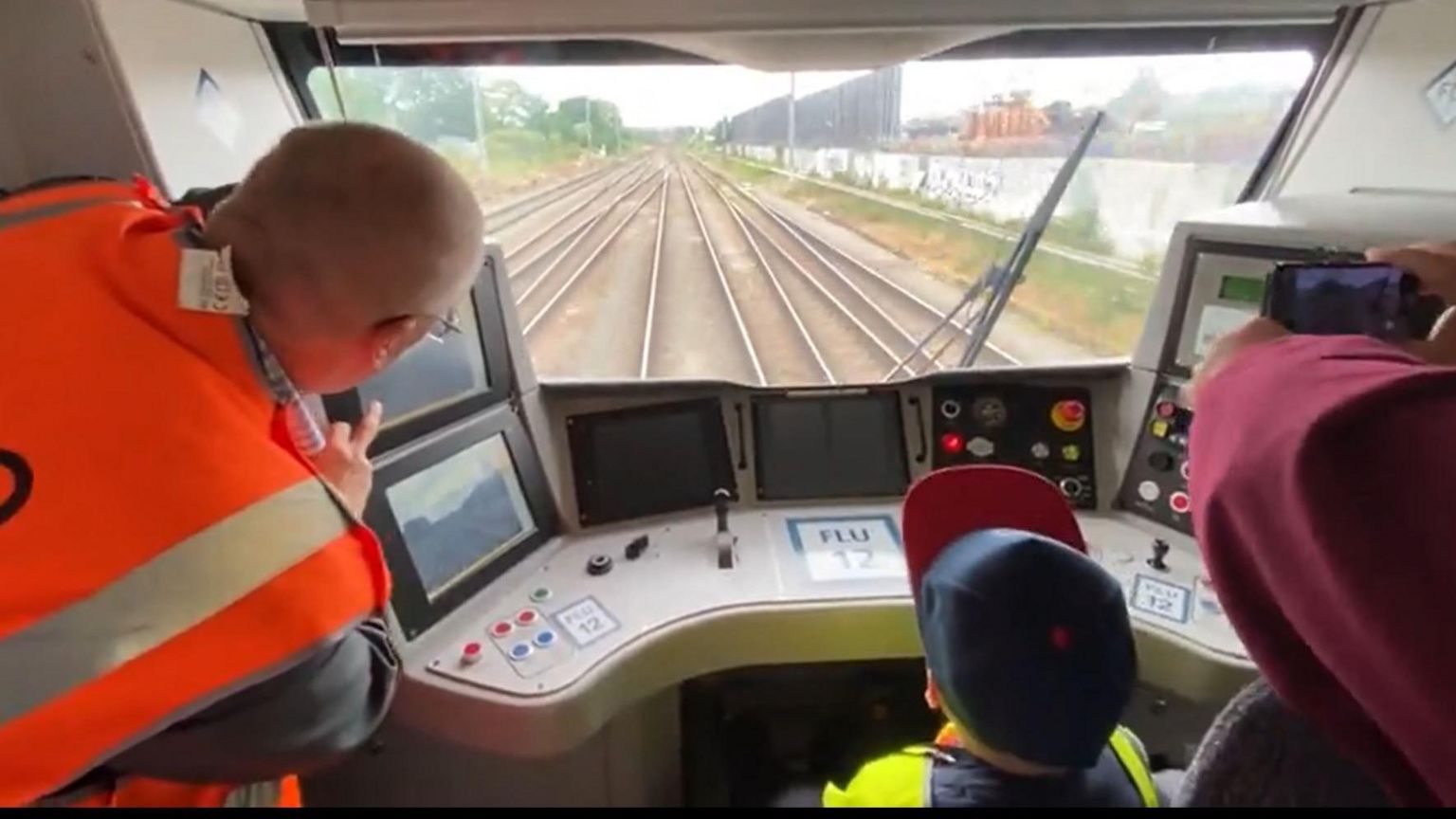 Alfie and Barry in the train cab looking at railway