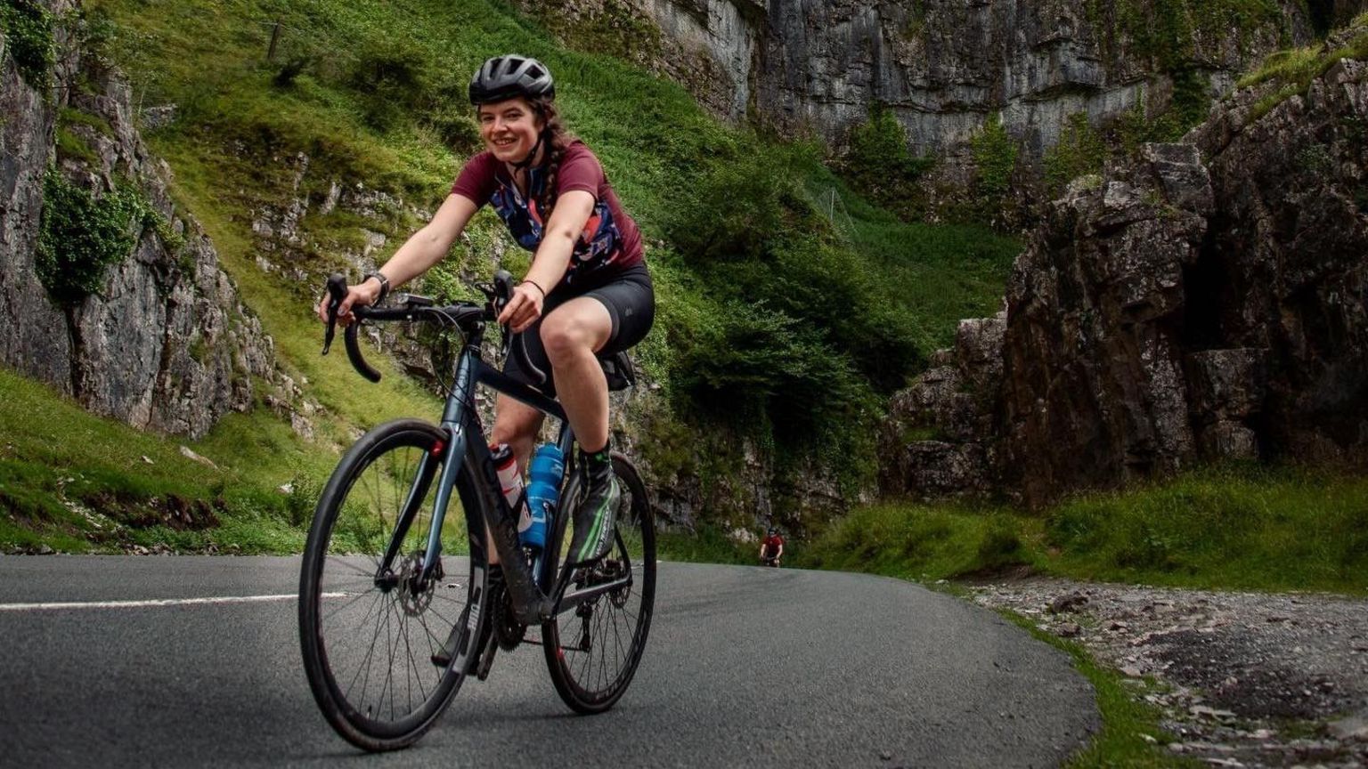 Esme Moore riding her bike through Cheddar Gorge