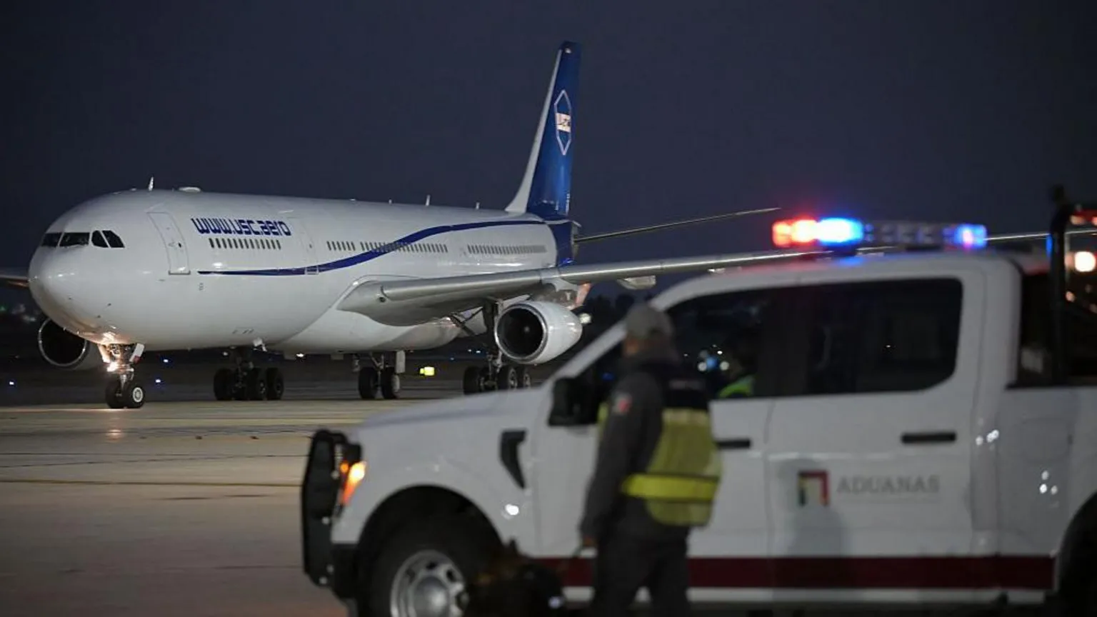 Getty Images A customs officer looks at the plane carrying Iran's football team while landing at the Tijuana International Airport in Tijuana, Mexico on June 7, 2026, ahead of the FIFA 2026 World Cup football tournament. (Photo by Guillermo Arias / AFP via Getty Images)