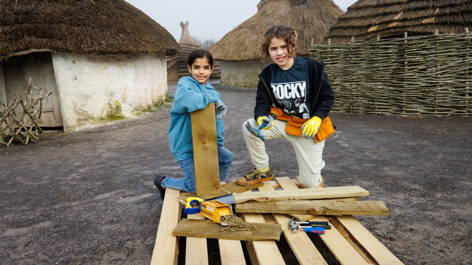 Children with building materials