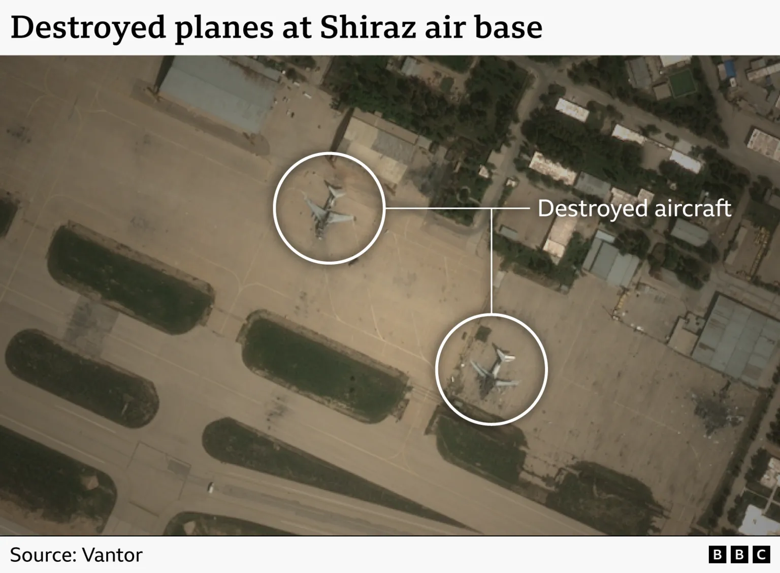 A satellite image showing damage to aircraft at Shiraz air base. The photo shows two destryoed planes sitting on the runway.