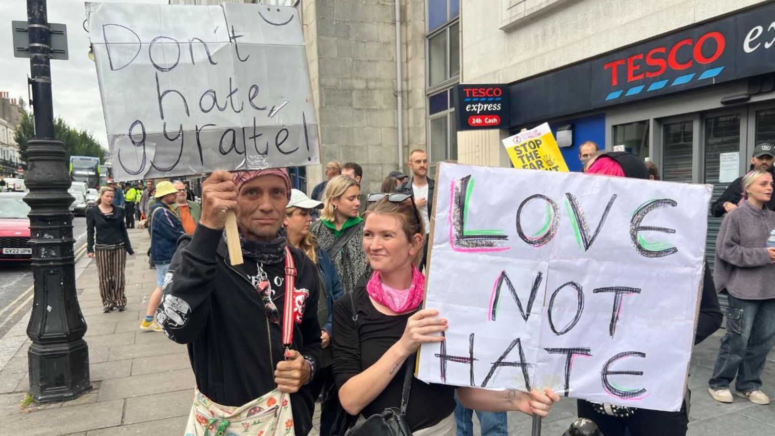 A 'Love Not Hate' sign held by a counter-protester in Brighton