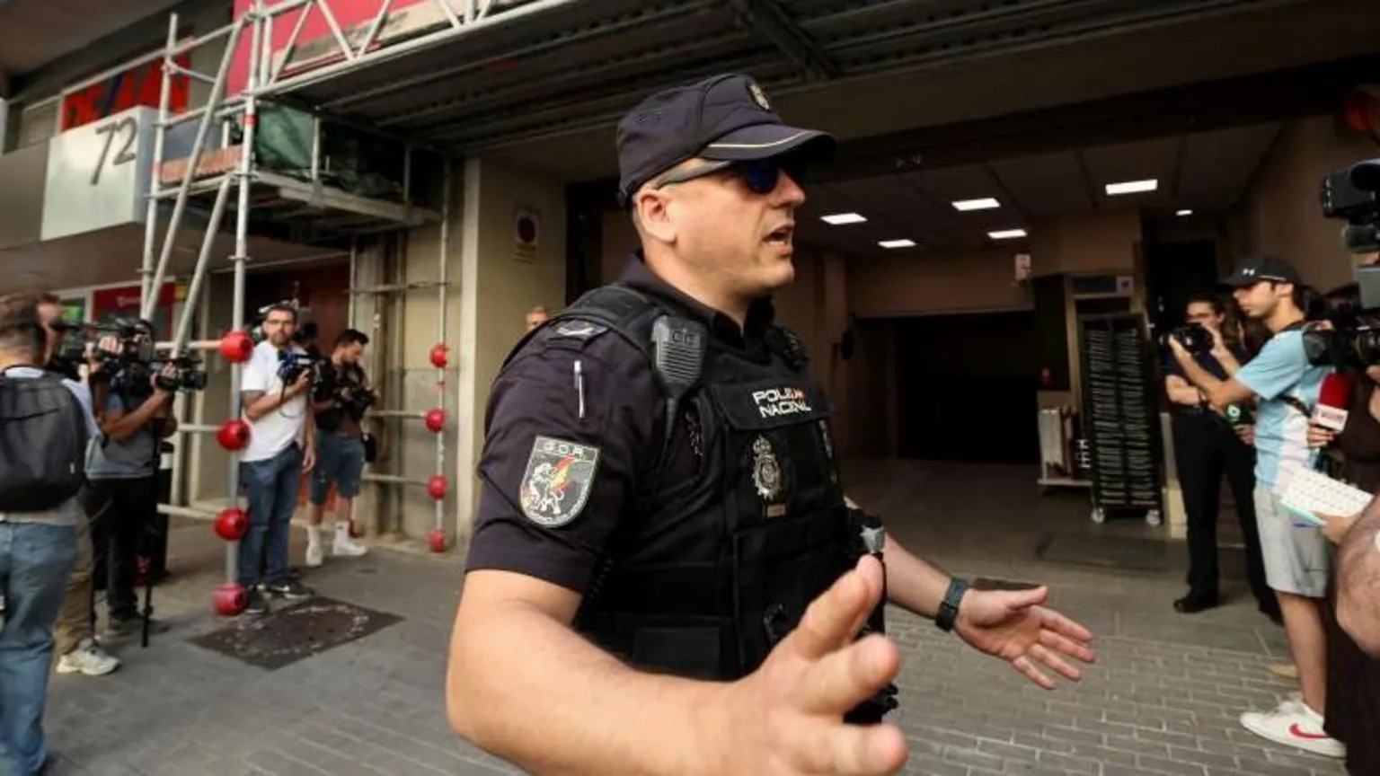 Reuters Members of the media work outside as Spanish police cordon off access to the Socialist Party's headquarters on a judicial order to gather information on a possible illegal financing scheme, as