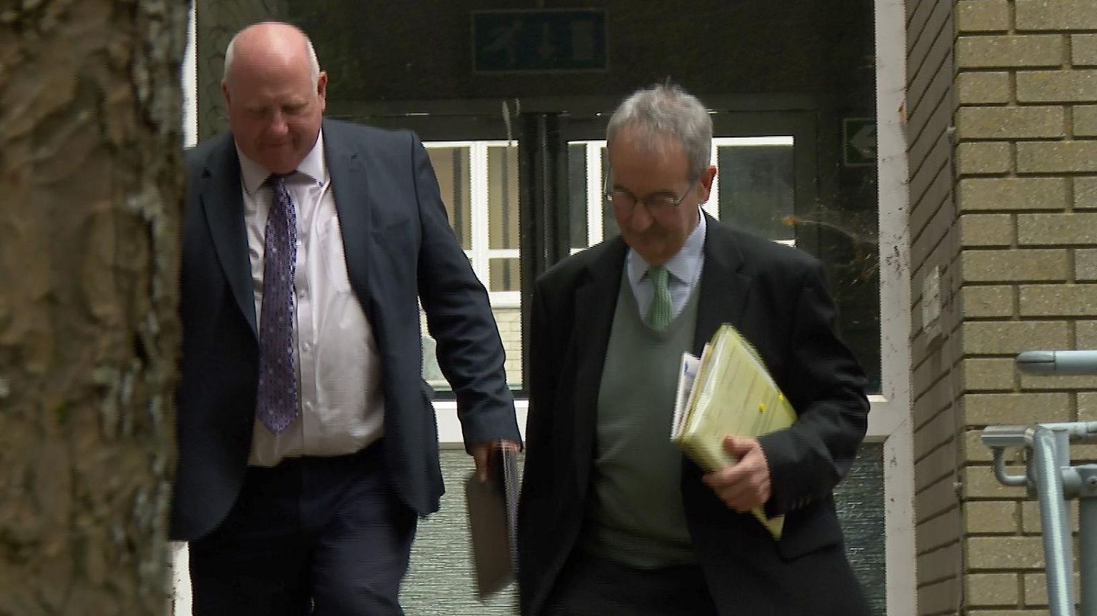 David Arwel Thomas and John Nicholas leave court