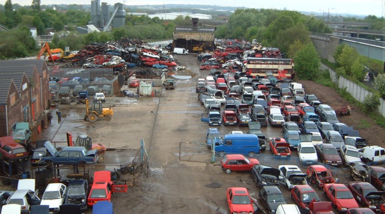 Aerial view of rows of cars ready for scrap