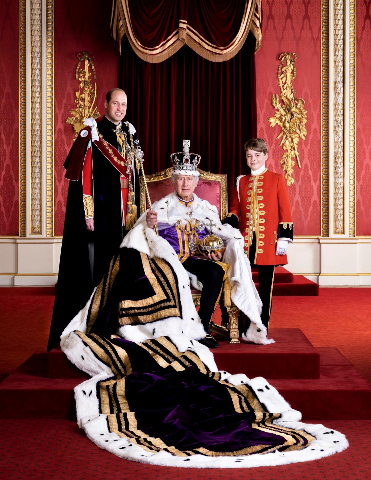 King Charles is pictured at Buckingham Palace seated on a throne - Prince William is on one side of him, and Prince George on the other