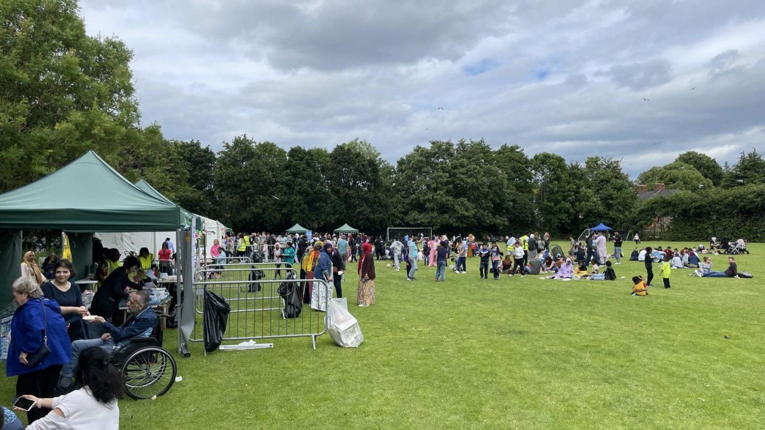 Wide view of the playing grounds where refugee picnic held