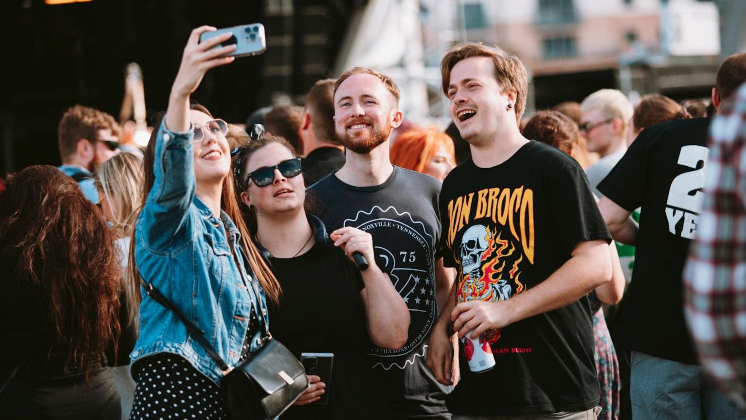 Four people take a selfie before the Busted concert at Bristol Sounds 2024.
