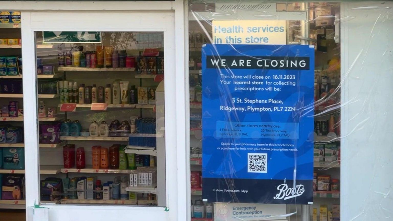 Boots chemist closing sign in street