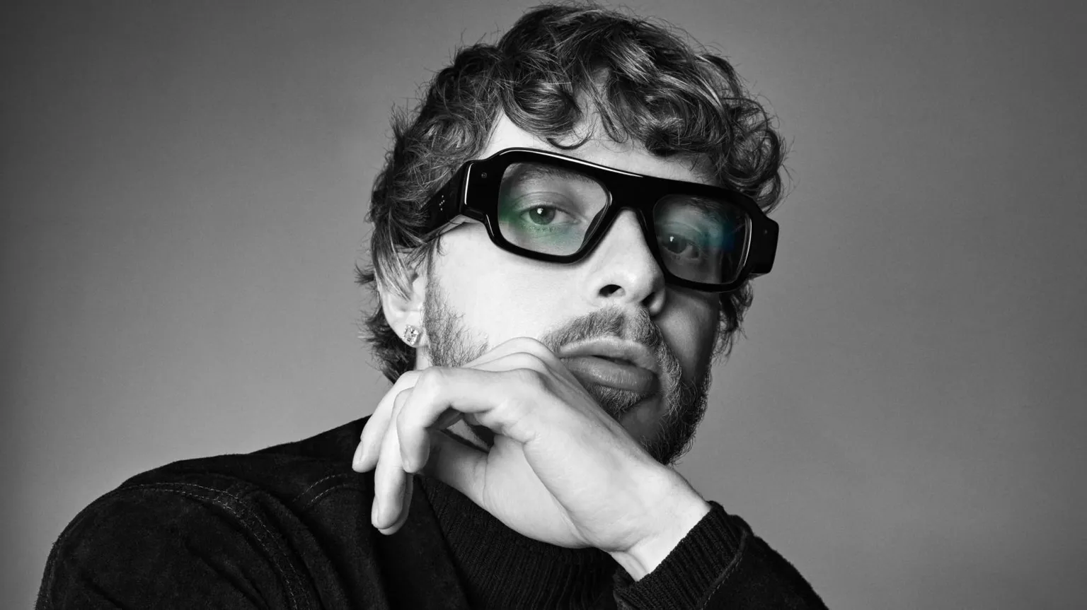 Snap Close up black and white photo of Jack Harlow wearing chunky black glasses