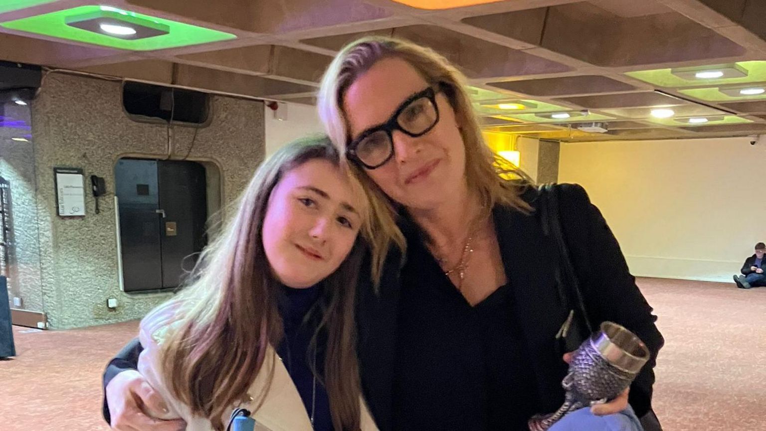 Actor Kate Winslet hugs visually impaired girl who has created a wishlist of places she wants to see before her sight deteriorates further