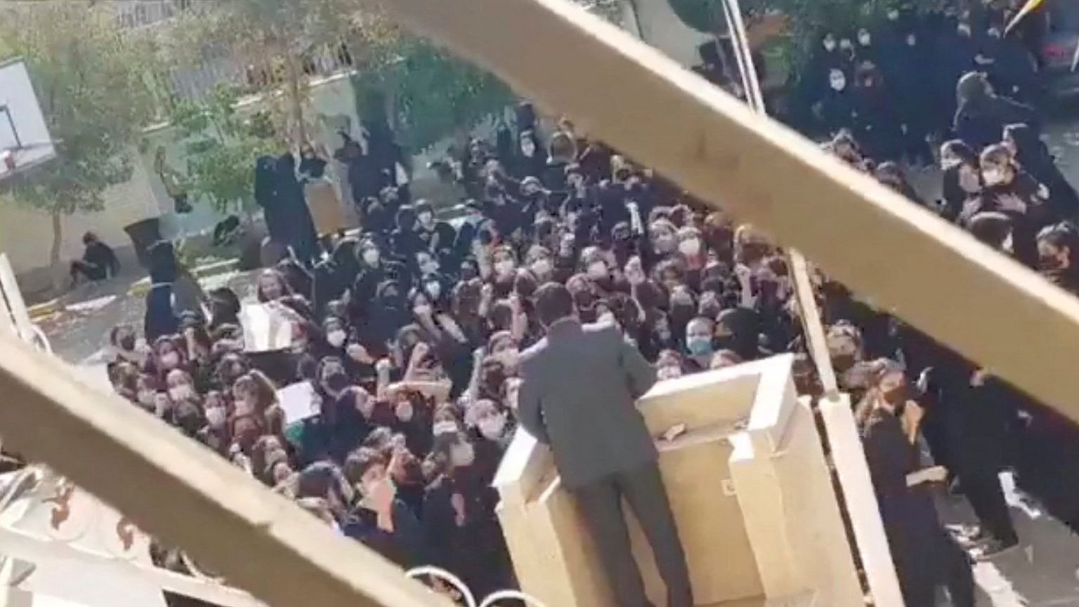 Screengrab of video posted online reportedly showing schoolgirls shouting "get lost" to a member of the paramilitary Basjij force in Iran