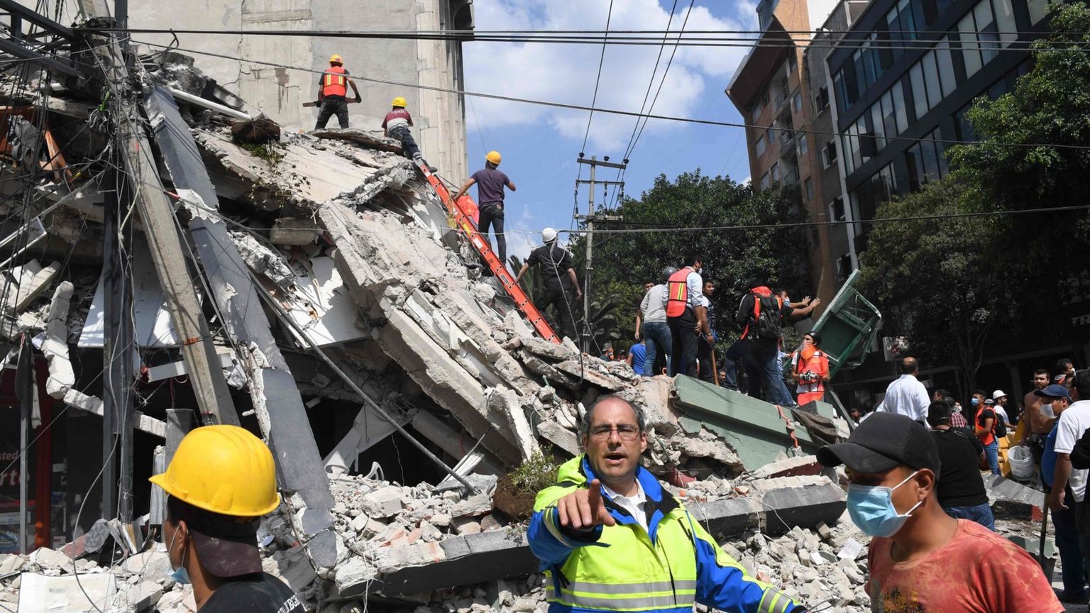 Rescuers search for survivors amid the rubble of a collapsed building in Mexico City on September 19, 2017