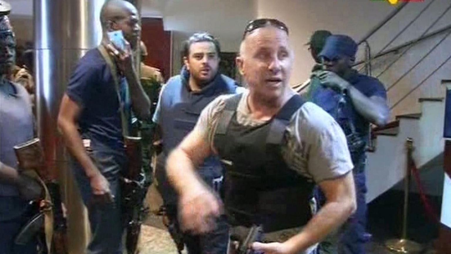 TV image taken from Mali TV ORTM, shows security officersinside the Radisson Blu Hotel in Bamako,