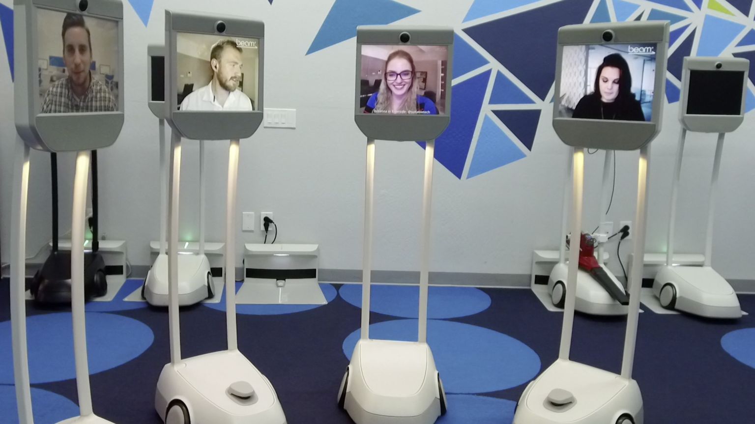 people in a virtual meeting via robots