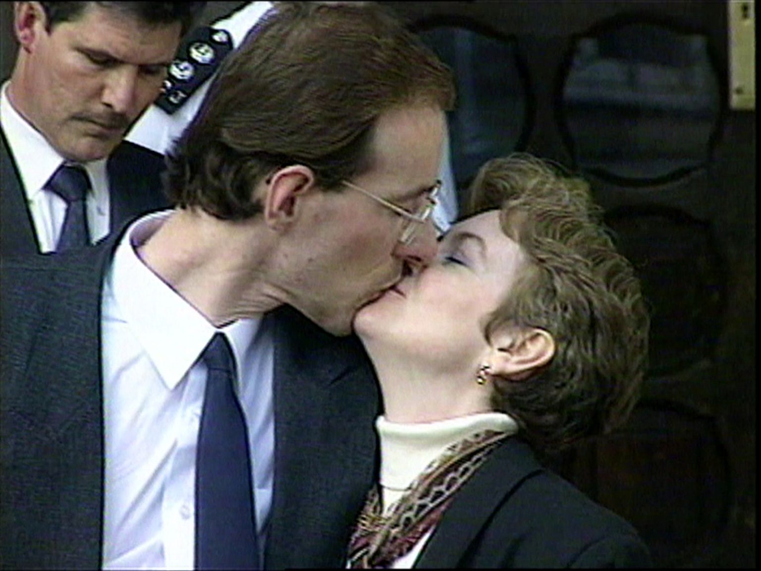 Cheryl Tooze and Jonathan Jones kiss outside court after his conviction is quashed