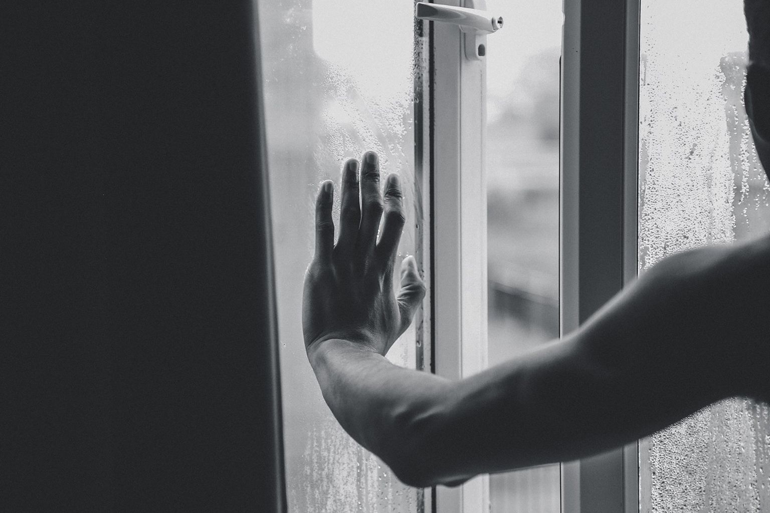 Hand on a window